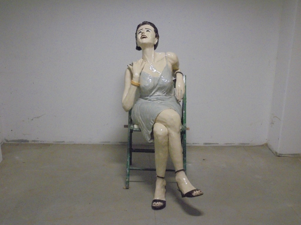 laughing girl on chair life size glazed ceramics